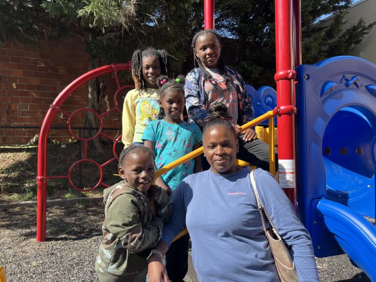 Mother and her kids on playground